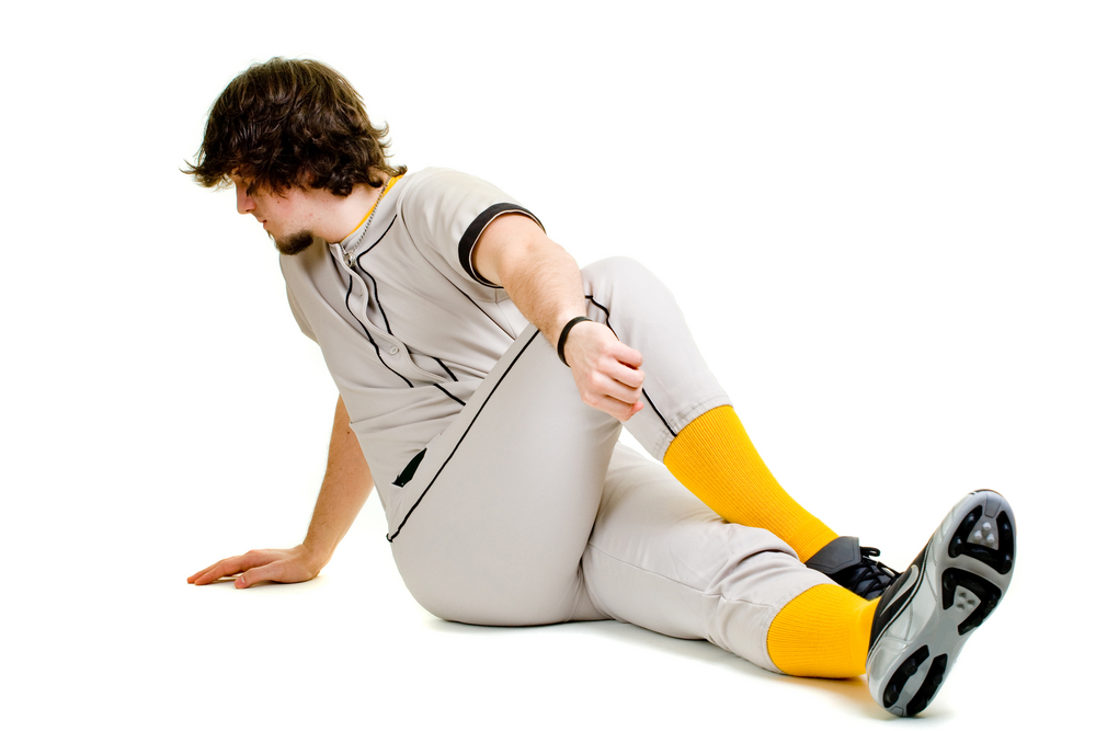 Baseball Player Stretching Thighs