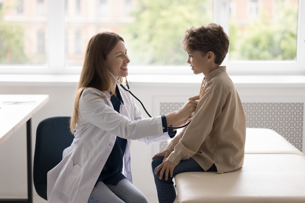 Pediatrician Examoning a Patient