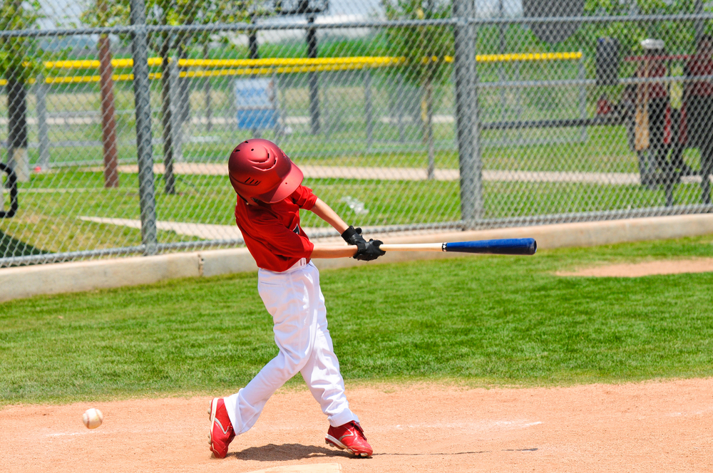 Youth Baseball Player Swinging a Bat