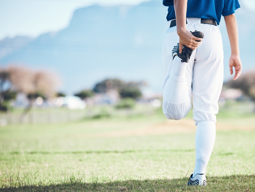 Youth Baseball Player Thigh Stretch